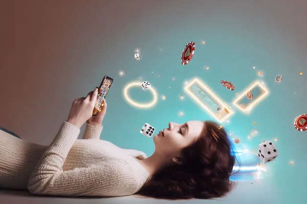 A young woman relaxing with her phone while dynamic casino elements float around her, illustrating the smooth mobile experience offered by the CD444 app.