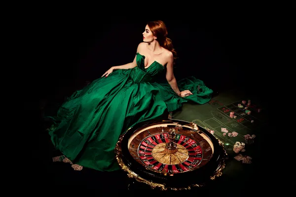 A woman in a luxurious green gown next to an ornate roulette wheel, capturing the upscale casino mood of CD444.