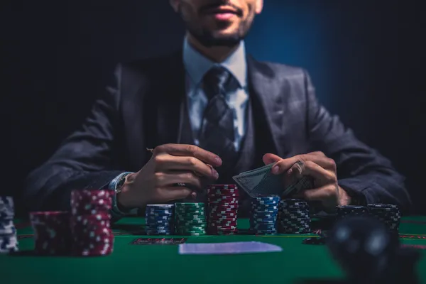 A confident dealer surrounded by casino chips inviting players to access their CD444 account, reflecting quick and easy login options.